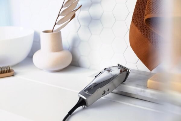 "Andis Master Clipper with adjustable blade and aluminum body for professional hair cutting" "Close-up of Andis Master adjustable blade clipper for fades and tapers"