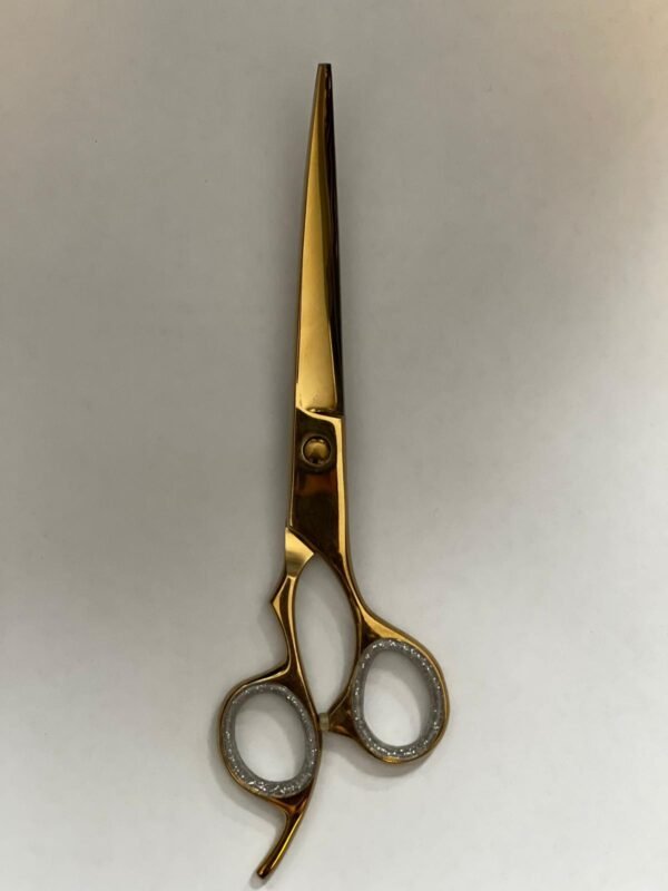 7-inch-professional-barber-scissors-stainless-steel-razor-edge.jpg  "Close-up of professional 7-inch barber scissors with silver stainless steel blades and an ergonomic offset handle."  barber-using-7-inch-shears-for-scissor-over-comb.jpg "Professional barber performing a scissor-over-comb technique using 7-inch hair cutting shears."  razor-edge-hollow-ground-blade-detail.jpg "Macro shot of the hand-honed razor edge on high-carbon steel barber scissors."