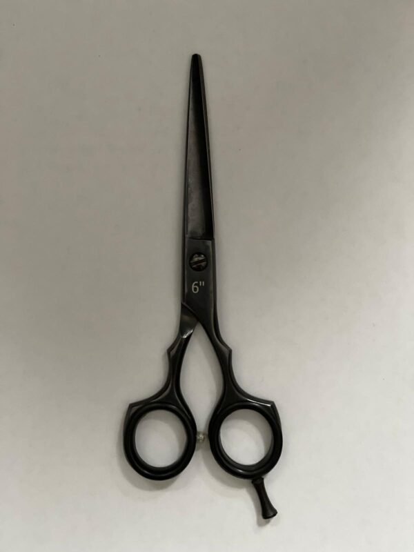 7-inch-professional-barber-scissors-stainless-steel-razor-edge.jpg  "Close-up of professional 7-inch barber scissors with silver stainless steel blades and an ergonomic offset handle."  barber-using-7-inch-shears-for-scissor-over-comb.jpg "Professional barber performing a scissor-over-comb technique using 7-inch hair cutting shears."  razor-edge-hollow-ground-blade-detail.jpg "Macro shot of the hand-honed razor edge on high-carbon steel barber scissors."