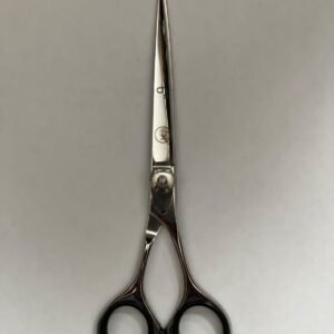 7-inch-professional-barber-scissors-stainless-steel-razor-edge.jpg  "Close-up of professional 7-inch barber scissors with silver stainless steel blades and an ergonomic offset handle."  barber-using-7-inch-shears-for-scissor-over-comb.jpg "Professional barber performing a scissor-over-comb technique using 7-inch hair cutting shears."  razor-edge-hollow-ground-blade-detail.jpg "Macro shot of the hand-honed razor edge on high-carbon steel barber scissors."