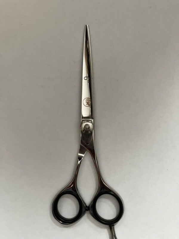 7-inch-professional-barber-scissors-stainless-steel-razor-edge.jpg  "Close-up of professional 7-inch barber scissors with silver stainless steel blades and an ergonomic offset handle."  barber-using-7-inch-shears-for-scissor-over-comb.jpg "Professional barber performing a scissor-over-comb technique using 7-inch hair cutting shears."  razor-edge-hollow-ground-blade-detail.jpg "Macro shot of the hand-honed razor edge on high-carbon steel barber scissors."