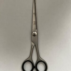 7-inch-professional-barber-scissors-stainless-steel-razor-edge.jpg  "Close-up of professional 7-inch barber scissors with silver stainless steel blades and an ergonomic offset handle."  barber-using-7-inch-shears-for-scissor-over-comb.jpg "Professional barber performing a scissor-over-comb technique using 7-inch hair cutting shears."  razor-edge-hollow-ground-blade-detail.jpg "Macro shot of the hand-honed razor edge on high-carbon steel barber scissors."
