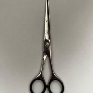 7-inch-professional-barber-scissors-stainless-steel-razor-edge.jpg  "Close-up of professional 7-inch barber scissors with silver stainless steel blades and an ergonomic offset handle."  barber-using-7-inch-shears-for-scissor-over-comb.jpg "Professional barber performing a scissor-over-comb technique using 7-inch hair cutting shears."  razor-edge-hollow-ground-blade-detail.jpg "Macro shot of the hand-honed razor edge on high-carbon steel barber scissors."