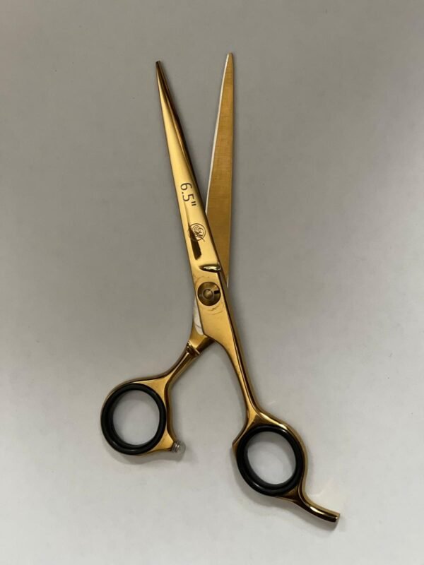 7-inch-professional-barber-scissors-stainless-steel-razor-edge.jpg  "Close-up of professional 7-inch barber scissors with silver stainless steel blades and an ergonomic offset handle."  barber-using-7-inch-shears-for-scissor-over-comb.jpg "Professional barber performing a scissor-over-comb technique using 7-inch hair cutting shears."  razor-edge-hollow-ground-blade-detail.jpg "Macro shot of the hand-honed razor edge on high-carbon steel barber scissors."
