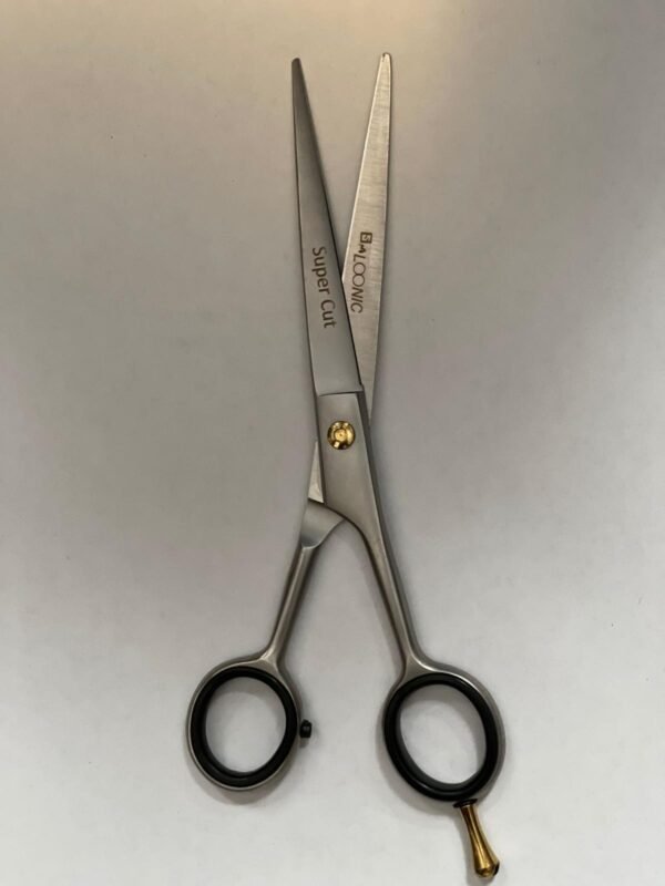 7-inch-professional-barber-scissors-stainless-steel-razor-edge.jpg  "Close-up of professional 7-inch barber scissors with silver stainless steel blades and an ergonomic offset handle."  barber-using-7-inch-shears-for-scissor-over-comb.jpg "Professional barber performing a scissor-over-comb technique using 7-inch hair cutting shears."  razor-edge-hollow-ground-blade-detail.jpg "Macro shot of the hand-honed razor edge on high-carbon steel barber scissors."