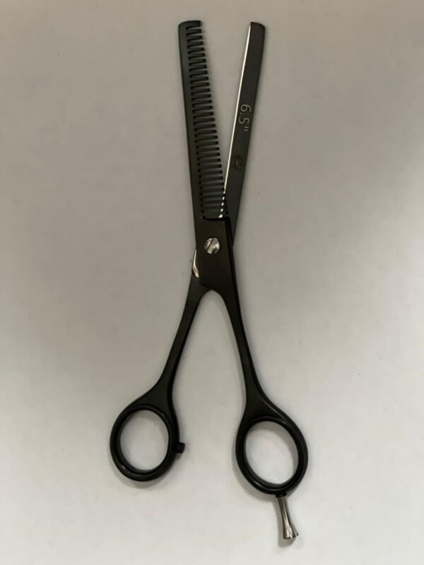 7-inch-professional-barber-scissors-stainless-steel-razor-edge.jpg  "Close-up of professional 7-inch barber scissors with silver stainless steel blades and an ergonomic offset handle."  barber-using-7-inch-shears-for-scissor-over-comb.jpg "Professional barber performing a scissor-over-comb technique using 7-inch hair cutting shears."  razor-edge-hollow-ground-blade-detail.jpg "Macro shot of the hand-honed razor edge on high-carbon steel barber scissors."