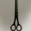 7-inch-professional-barber-scissors-stainless-steel-razor-edge.jpg  "Close-up of professional 7-inch barber scissors with silver stainless steel blades and an ergonomic offset handle."  barber-using-7-inch-shears-for-scissor-over-comb.jpg "Professional barber performing a scissor-over-comb technique using 7-inch hair cutting shears."  razor-edge-hollow-ground-blade-detail.jpg "Macro shot of the hand-honed razor edge on high-carbon steel barber scissors."