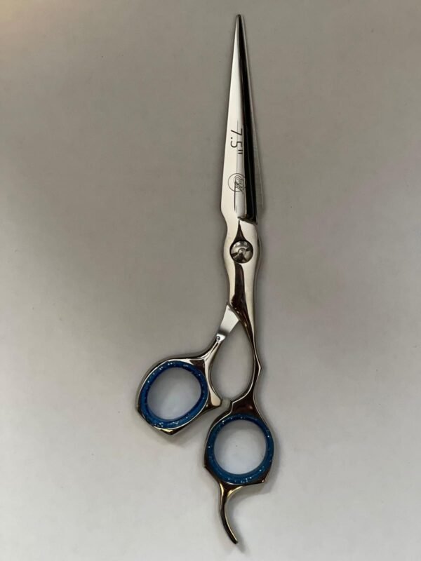 7-inch-professional-barber-scissors-stainless-steel-razor-edge.jpg  "Close-up of professional 7-inch barber scissors with silver stainless steel blades and an ergonomic offset handle."  barber-using-7-inch-shears-for-scissor-over-comb.jpg "Professional barber performing a scissor-over-comb technique using 7-inch hair cutting shears."  razor-edge-hollow-ground-blade-detail.jpg "Macro shot of the hand-honed razor edge on high-carbon steel barber scissors."