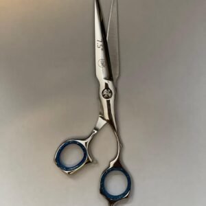 7-inch-professional-barber-scissors-stainless-steel-razor-edge.jpg  "Close-up of professional 7-inch barber scissors with silver stainless steel blades and an ergonomic offset handle."  barber-using-7-inch-shears-for-scissor-over-comb.jpg "Professional barber performing a scissor-over-comb technique using 7-inch hair cutting shears."  razor-edge-hollow-ground-blade-detail.jpg "Macro shot of the hand-honed razor edge on high-carbon steel barber scissors."