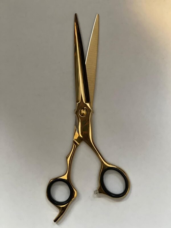 7-inch-professional-barber-scissors-stainless-steel-razor-edge.jpg  "Close-up of professional 7-inch barber scissors with silver stainless steel blades and an ergonomic offset handle."  barber-using-7-inch-shears-for-scissor-over-comb.jpg "Professional barber performing a scissor-over-comb technique using 7-inch hair cutting shears."  razor-edge-hollow-ground-blade-detail.jpg "Macro shot of the hand-honed razor edge on high-carbon steel barber scissors."