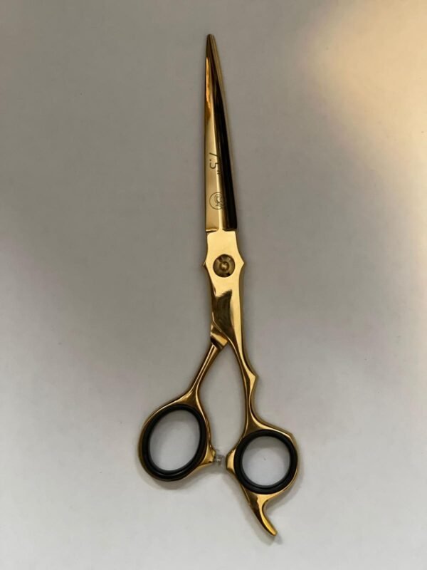 professional-barber-scissors-stainless-steel-razor-edge.jpg  "Close-up of professional 7-inch barber scissors with silver stainless steel blades and an ergonomic offset handle."  barber-using-shears-for-scissor-over-comb.jpg "Professional barber performing a scissor-over-comb technique using 7-inch hair cutting shears."  razor-edge-hollow-ground-blade-detail.jpg "Macro shot of the hand-honed razor edge on high-carbon steel barber scissors."