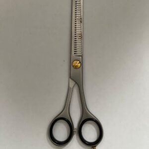 7-inch-professional-barber-scissors-stainless-steel-razor-edge.jpg "Close-up of professional 7-inch barber scissors with silver stainless steel blades and an ergonomic offset handle." barber-using-7-inch-shears-for-scissor-over-comb.jpg "Professional barber performing a scissor-over-comb technique using 7-inch hair cutting shears." razor-edge-hollow-ground-blade-detail.jpg "Macro shot of the hand-honed razor edge on high-carbon steel barber scissors."