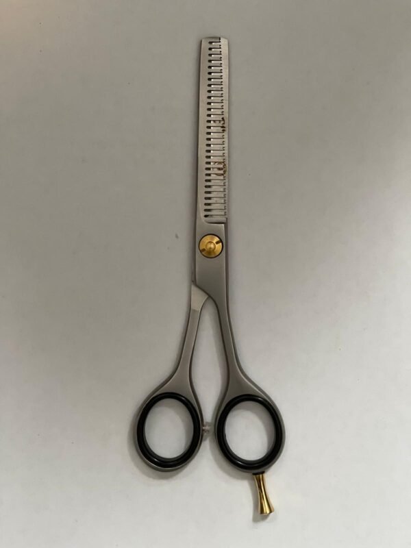 7-inch-professional-barber-scissors-stainless-steel-razor-edge.jpg  "Close-up of professional 7-inch barber scissors with silver stainless steel blades and an ergonomic offset handle."  barber-using-7-inch-shears-for-scissor-over-comb.jpg "Professional barber performing a scissor-over-comb technique using 7-inch hair cutting shears."  razor-edge-hollow-ground-blade-detail.jpg "Macro shot of the hand-honed razor edge on high-carbon steel barber scissors."