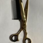 7-inch-professional-barber-scissors-stainless-steel-razor-edge.jpg  "Close-up of professional 7-inch barber scissors with silver stainless steel blades and an ergonomic offset handle."  barber-using-7-inch-shears-for-scissor-over-comb.jpg "Professional barber performing a scissor-over-comb technique using 7-inch hair cutting shears."  razor-edge-hollow-ground-blade-detail.jpg "Macro shot of the hand-honed razor edge on high-carbon steel barber scissors."