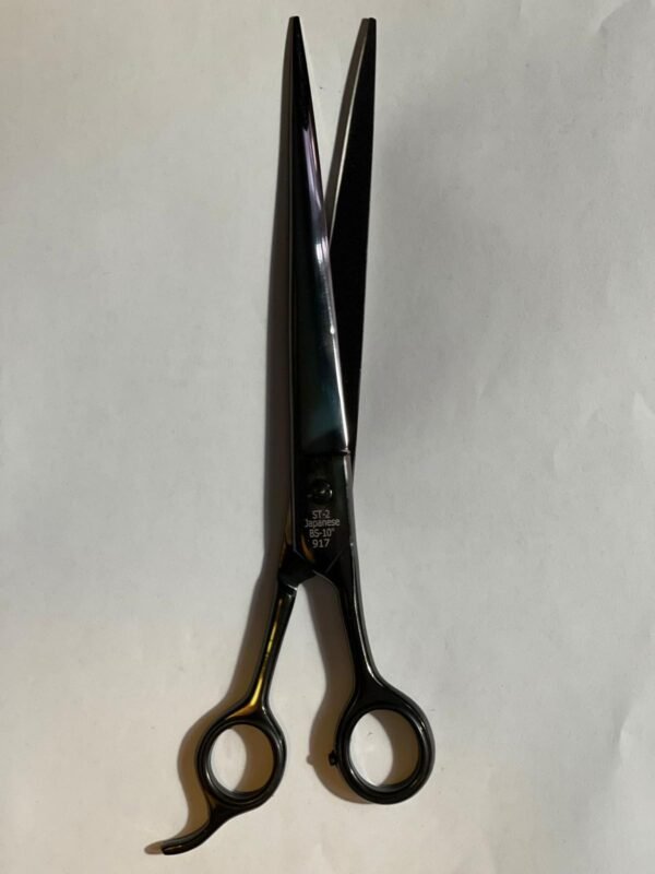 7-inch-professional-barber-scissors-stainless-steel-razor-edge.jpg  "Close-up of professional 7-inch barber scissors with silver stainless steel blades and an ergonomic offset handle."  barber-using-7-inch-shears-for-scissor-over-comb.jpg "Professional barber performing a scissor-over-comb technique using 7-inch hair cutting shears."  razor-edge-hollow-ground-blade-detail.jpg "Macro shot of the hand-honed razor edge on high-carbon steel barber scissors."