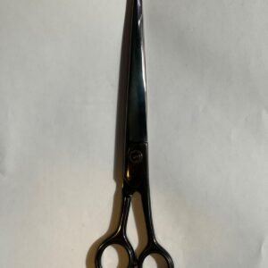 7-inch-professional-barber-scissors-stainless-steel-razor-edge.jpg "Close-up of professional 7-inch barber scissors with silver stainless steel blades and an ergonomic offset handle." barber-using-7-inch-shears-for-scissor-over-comb.jpg "Professional barber performing a scissor-over-comb technique using 7-inch hair cutting shears." razor-edge-hollow-ground-blade-detail.jpg "Macro shot of the hand-honed razor edge on high-carbon steel barber scissors."
