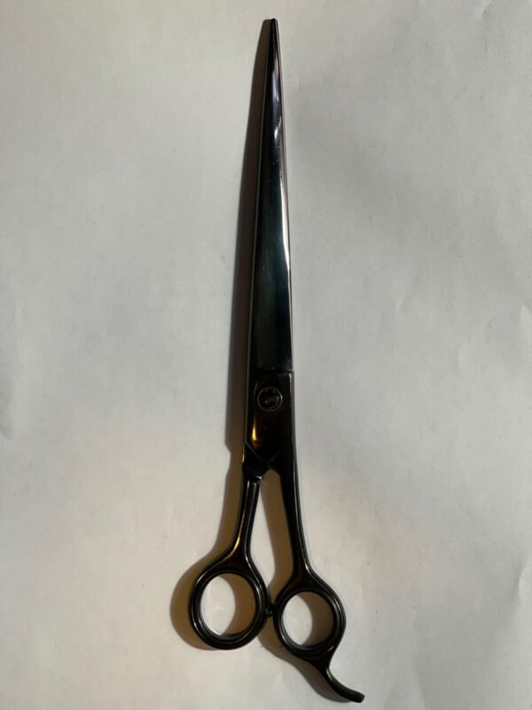 7-inch-professional-barber-scissors-stainless-steel-razor-edge.jpg  "Close-up of professional 7-inch barber scissors with silver stainless steel blades and an ergonomic offset handle."  barber-using-7-inch-shears-for-scissor-over-comb.jpg "Professional barber performing a scissor-over-comb technique using 7-inch hair cutting shears."  razor-edge-hollow-ground-blade-detail.jpg "Macro shot of the hand-honed razor edge on high-carbon steel barber scissors."