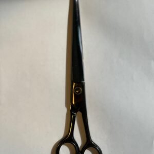 7-inch-professional-barber-scissors-stainless-steel-razor-edge.jpg  "Close-up of professional 7-inch barber scissors with silver stainless steel blades and an ergonomic offset handle."  barber-using-7-inch-shears-for-scissor-over-comb.jpg "Professional barber performing a scissor-over-comb technique using 7-inch hair cutting shears."  razor-edge-hollow-ground-blade-detail.jpg "Macro shot of the hand-honed razor edge on high-carbon steel barber scissors."