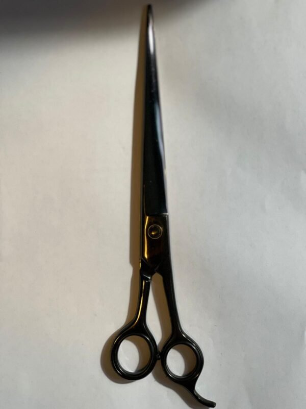 7-inch-professional-barber-scissors-stainless-steel-razor-edge.jpg  "Close-up of professional 7-inch barber scissors with silver stainless steel blades and an ergonomic offset handle."  barber-using-7-inch-shears-for-scissor-over-comb.jpg "Professional barber performing a scissor-over-comb technique using 7-inch hair cutting shears."  razor-edge-hollow-ground-blade-detail.jpg "Macro shot of the hand-honed razor edge on high-carbon steel barber scissors."