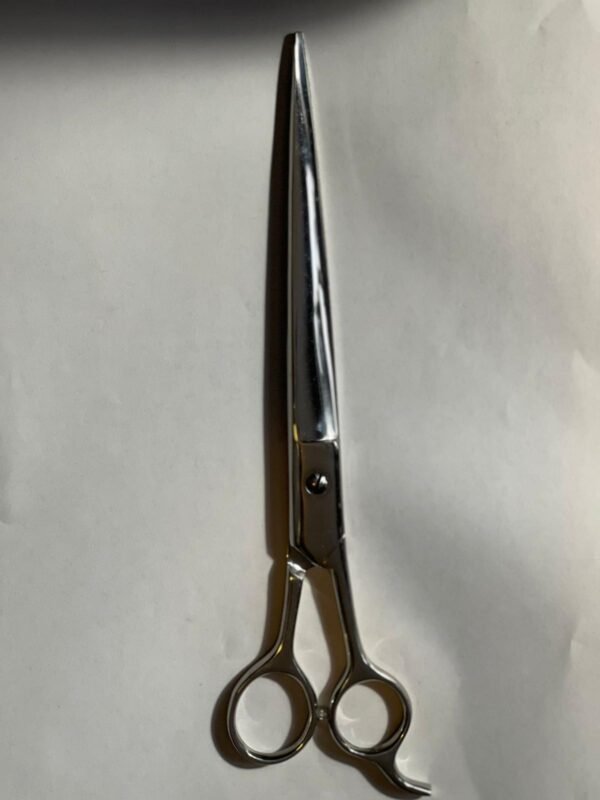 7-inch-professional-barber-scissors-stainless-steel-razor-edge.jpg  "Close-up of professional 7-inch barber scissors with silver stainless steel blades and an ergonomic offset handle."  barber-using-7-inch-shears-for-scissor-over-comb.jpg "Professional barber performing a scissor-over-comb technique using 7-inch hair cutting shears."  razor-edge-hollow-ground-blade-detail.jpg "Macro shot of the hand-honed razor edge on high-carbon steel barber scissors."