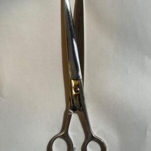 7-inch-professional-barber-scissors-stainless-steel-razor-edge.jpg  "Close-up of professional 7-inch barber scissors with silver stainless steel blades and an ergonomic offset handle."  barber-using-7-inch-shears-for-scissor-over-comb.jpg "Professional barber performing a scissor-over-comb technique using 7-inch hair cutting shears."  razor-edge-hollow-ground-blade-detail.jpg "Macro shot of the hand-honed razor edge on high-carbon steel barber scissors."