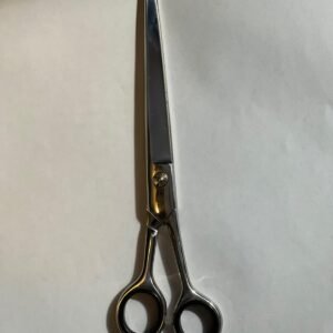 7-inch-professional-barber-scissors-stainless-steel-razor-edge.jpg  "Close-up of professional 7-inch barber scissors with silver stainless steel blades and an ergonomic offset handle."  barber-using-7-inch-shears-for-scissor-over-comb.jpg "Professional barber performing a scissor-over-comb technique using 7-inch hair cutting shears."  razor-edge-hollow-ground-blade-detail.jpg "Macro shot of the hand-honed razor edge on high-carbon steel barber scissors."