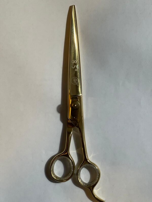 7-inch-professional-barber-scissors-stainless-steel-razor-edge.jpg  "Close-up of professional 7-inch barber scissors with silver stainless steel blades and an ergonomic offset handle."  barber-using-7-inch-shears-for-scissor-over-comb.jpg "Professional barber performing a scissor-over-comb technique using 7-inch hair cutting shears."  razor-edge-hollow-ground-blade-detail.jpg "Macro shot of the hand-honed razor edge on high-carbon steel barber scissors."