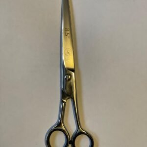 7-inch-professional-barber-scissors-stainless-steel-razor-edge.jpg  "Close-up of professional 7-inch barber scissors with silver stainless steel blades and an ergonomic offset handle."  barber-using-7-inch-shears-for-scissor-over-comb.jpg "Professional barber performing a scissor-over-comb technique using 7-inch hair cutting shears."  razor-edge-hollow-ground-blade-detail.jpg "Macro shot of the hand-honed razor edge on high-carbon steel barber scissors."
