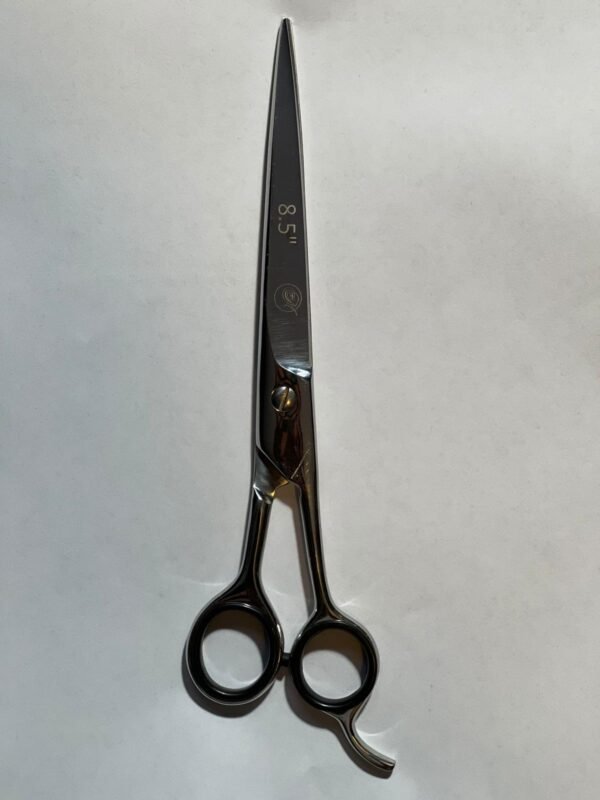 7-inch-professional-barber-scissors-stainless-steel-razor-edge.jpg  "Close-up of professional 7-inch barber scissors with silver stainless steel blades and an ergonomic offset handle."  barber-using-7-inch-shears-for-scissor-over-comb.jpg "Professional barber performing a scissor-over-comb technique using 7-inch hair cutting shears."  razor-edge-hollow-ground-blade-detail.jpg "Macro shot of the hand-honed razor edge on high-carbon steel barber scissors."