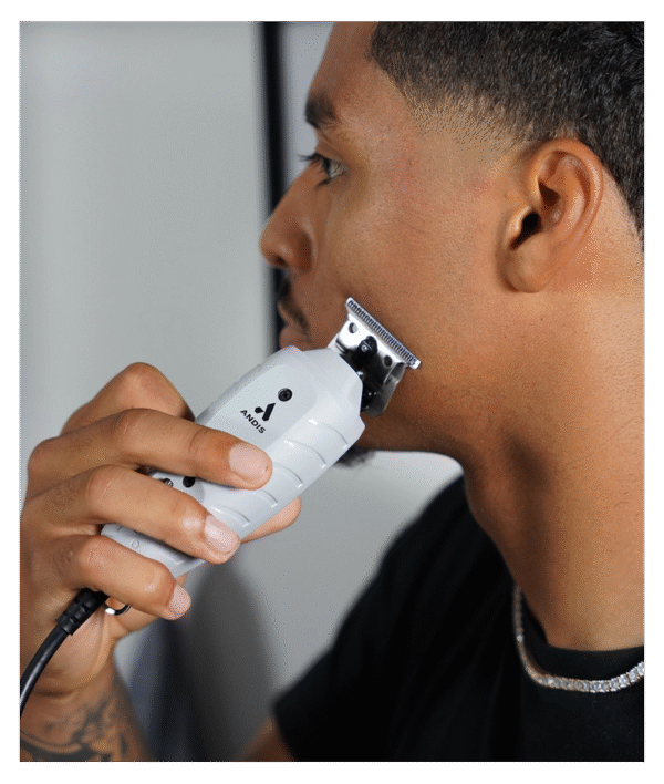 ANDIS T-Outliner Professional Hair Trimmer with carbon-steel T-blade for precision outlining, beard detailing, line-ups, and professional barber grooming.